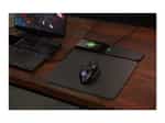 a computer mouse and a laptop on a desk