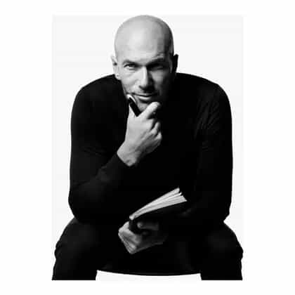 a man holding a pen and a book