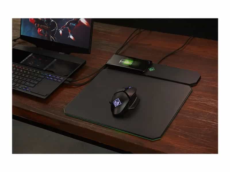 a computer mouse and a laptop on a desk