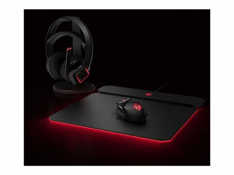 hp-omen-charging-mouse-pad a black mouse pad and headphones