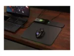 a computer mouse and a laptop on a desk