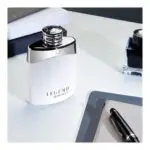 a bottle of perfume on a table