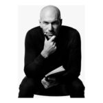 a man holding a pen and a book